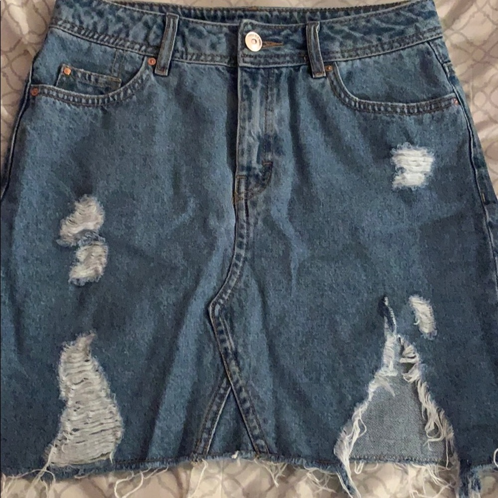 very ripped jean skirt